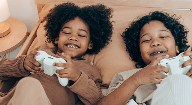 Two kids playing online games